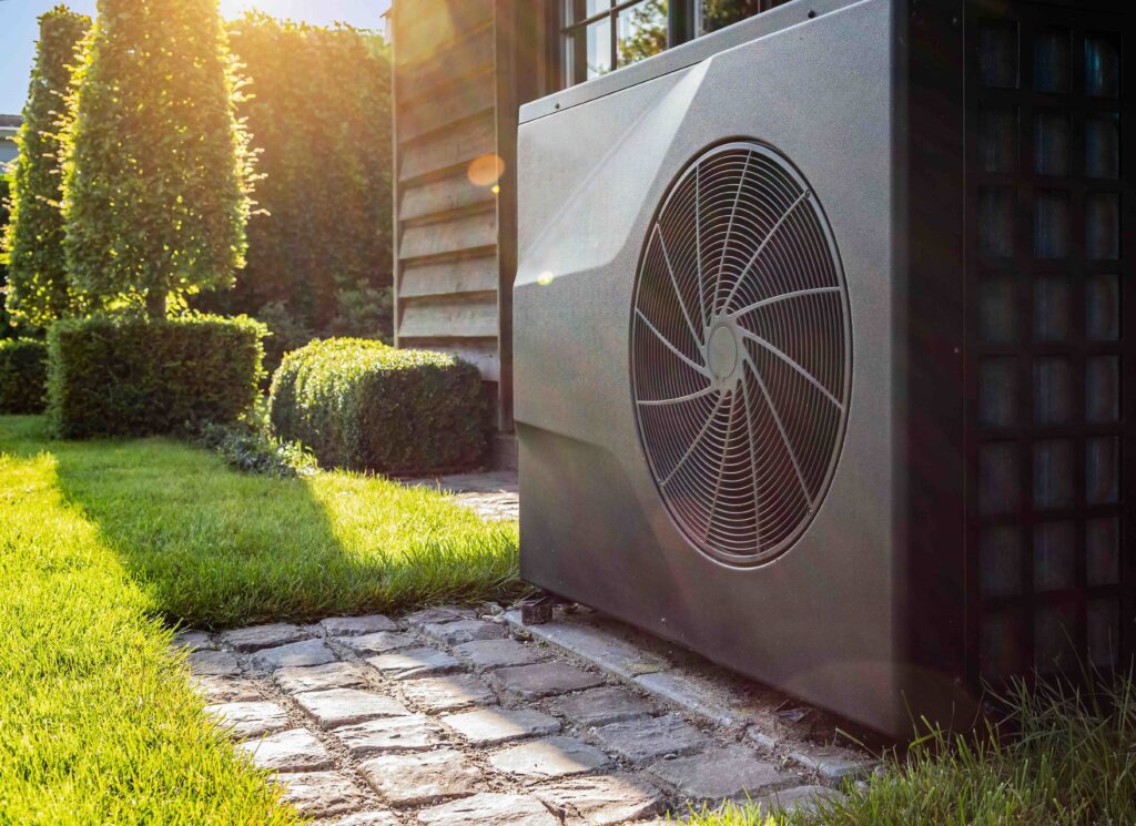 Air heat pump near pool house outdoors.