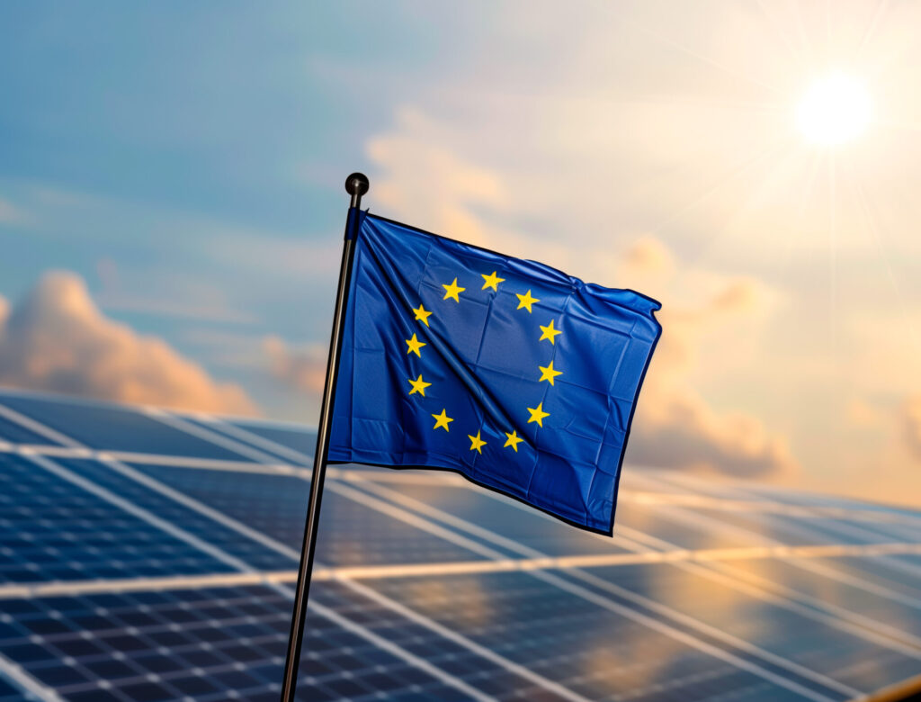 Eu flag with solar panels, symbolizing renewable energy policy.